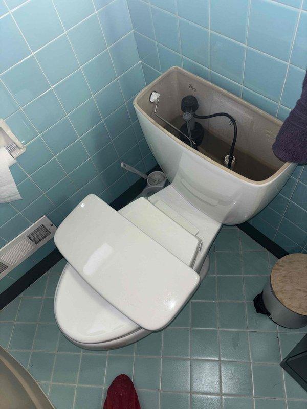 Diagnosed and repaired a continuously running toilet located in the main level hallway bathroom. Upon inspection of the internal flush mechanism, identified and replaced faulty components causing the tank to cycle and refill when not in use. Verified proper operation after repair with successful flush cycle and no further water leakage.