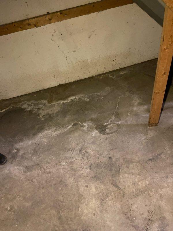 Conducted site evaluation for bathroom installation in unfinished basement area requiring concrete cutting for new plumbing lines. Inspected existing water heater and copper supply lines to determine integration points for proposed bathroom fixtures. Documented floor conditions showing significant cracking and water damage that will need addressing before installation proceeds.