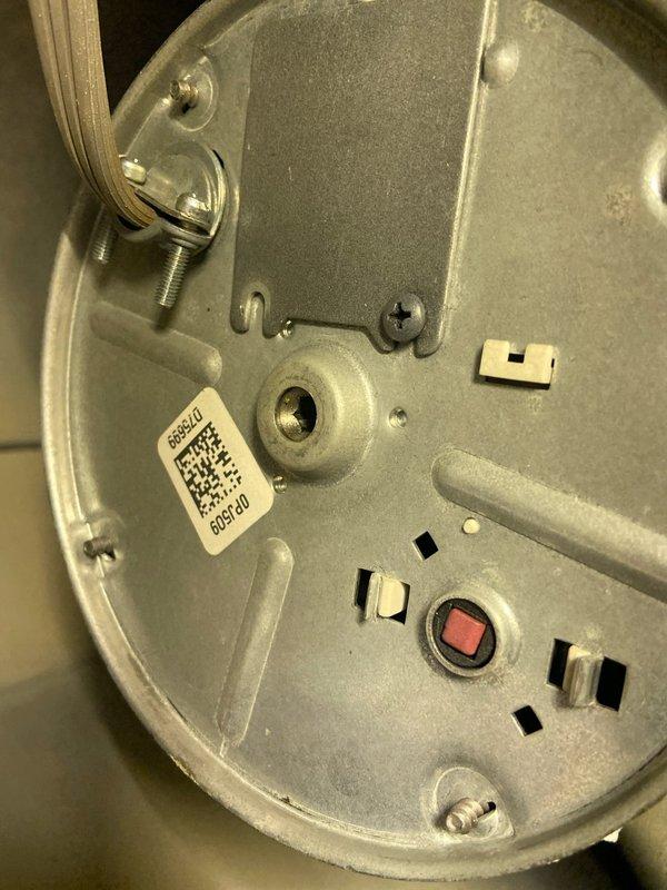 Responded to service call for non-operational garbage disposal in kitchen sink. Upon inspection, identified an InSinkErator unit that required reset. Accessed reset button on underside of unit, cleared minor debris from disposal chamber, and verified proper operation after reset. Unit now functioning correctly with no leaks observed at connections.