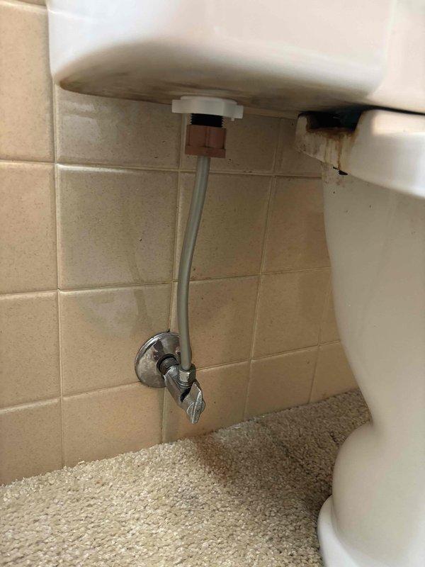 Responded to water leak complaint between shower and basement ceiling. Conducted thorough inspection of bathroom plumbing fixtures, focusing on toilet and shower connections. Identified and repaired leak at toilet supply line connection, which was causing water penetration through the ceiling below. Confirmed proper function after repair with no further leakage observed.