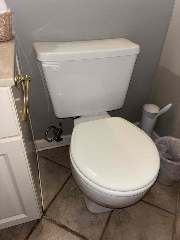 Responded to water leak complaint between shower and basement ceiling. Conducted thorough inspection of bathroom plumbing fixtures, focusing on toilet and shower connections. Identified and repaired leak at toilet supply line connection, which was causing water penetration through the ceiling below. Confirmed proper function after repair with no further leakage observed.