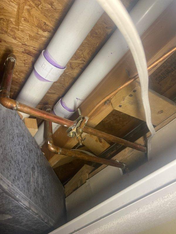 Replaced failing saddle valve on refrigerator water supply line in basement with new valve. Inspected surrounding copper supply lines and PVC drainage system to ensure proper installation and function. All connections were tested for leaks and system is now operating correctly.