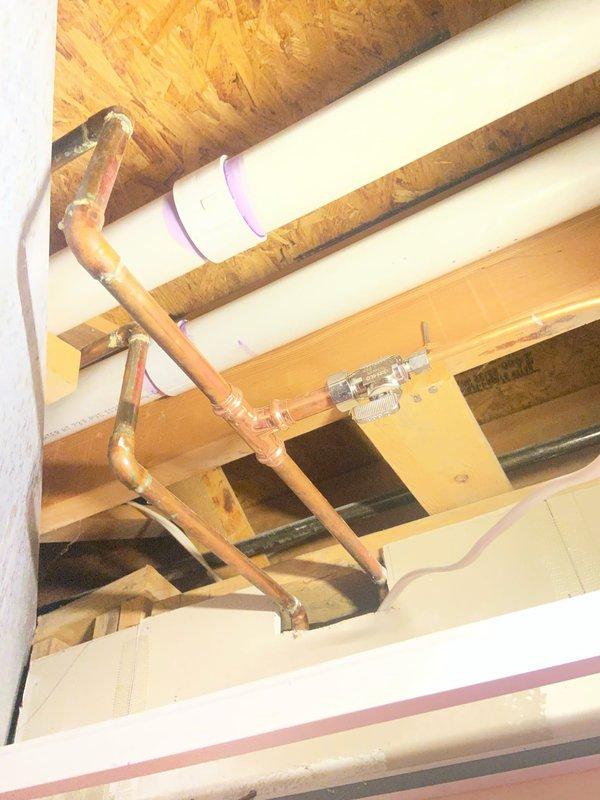 Replaced failing saddle valve on refrigerator water supply line in basement with new valve. Inspected surrounding copper supply lines and PVC drainage system to ensure proper installation and function. All connections were tested for leaks and system is now operating correctly.