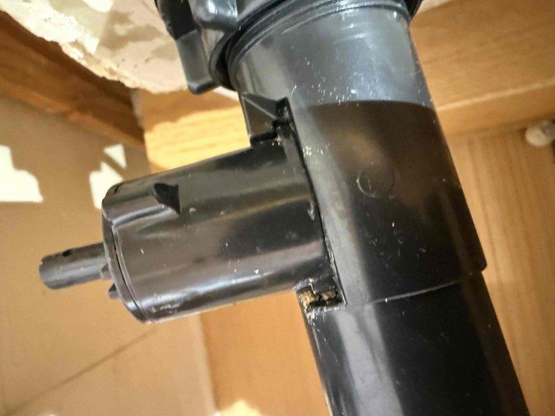 Responded to service call for bathroom sink leak causing cabinet wood damage. Upon inspection, discovered a cracked PVC drainage pipe at the connection point where the smaller fitting meets the main pipe body. Replaced damaged section with new PVC pipe and fittings, properly sealed all connections, and verified system integrity with leak test.