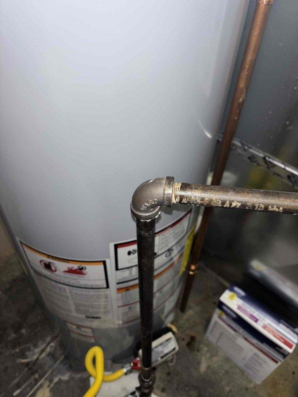 Responded to customer-reported occasional faint gas smell from recently installed water heater (2024 installation). Conducted comprehensive inspection of the tank system, gas line connections, and associated plumbing. Found minor corrosion at pipe joint requiring preventative maintenance; cleaned connection points and verified proper gas line installation to eliminate odor source.