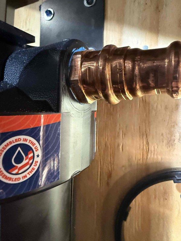 Responded to a water softener leak complaint. Upon inspection, found and repaired a faulty copper fitting connection to the water softener assembly. Verified proper operation with no signs of leakage after repair.