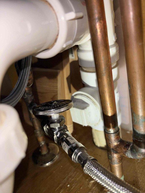 Inspected dishwasher water supply issue in 22-year-old home and identified significant corrosion on copper supply lines and water damage to cabinet floor beneath kitchen sink. Replaced corroded copper pipes, installed new shutoff valve with braided supply line, and verified proper water flow to dishwasher, restoring full functionality.