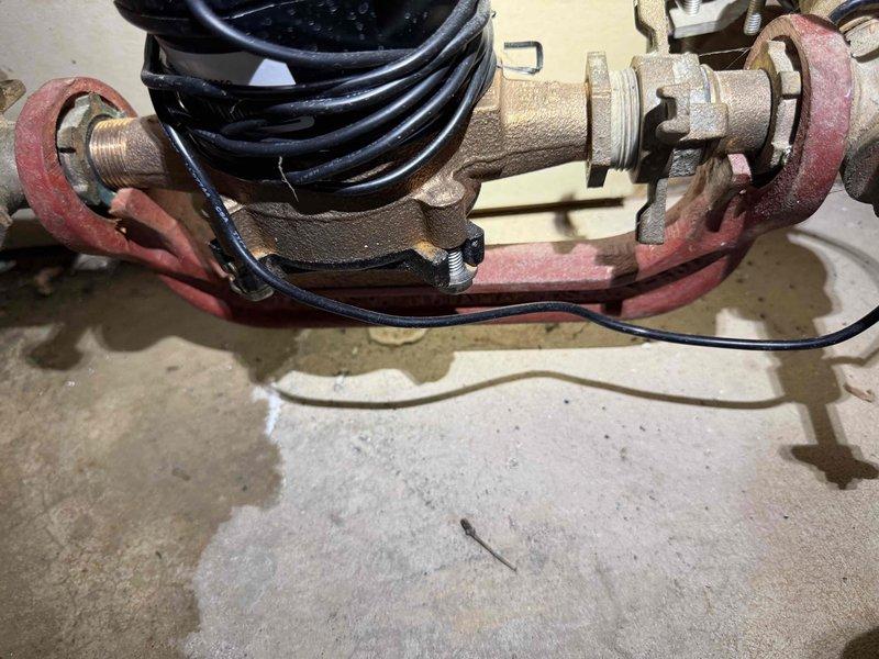 Responded to recall for a leaking pipe in basement previously replaced. Upon inspection, found water leakage around copper pipe assembly with valve. Repaired the leak by replacing the defective crimped fitting and applying proper pressure test to verify resolution. Documented repair with photos showing the completed work.