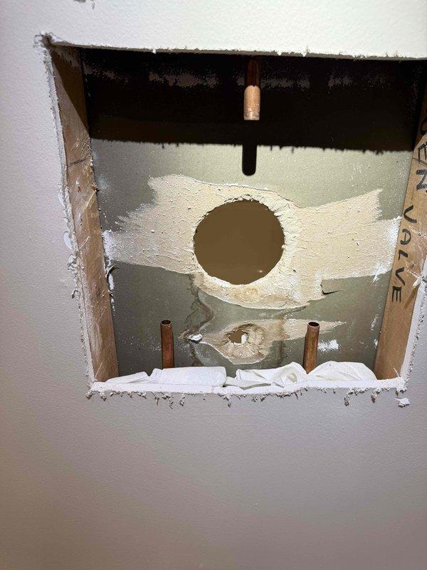 Successfully installed customer-supplied shower valve, requiring removal of drywall section to access plumbing infrastructure. Completed proper connection of valve assembly to existing copper supply lines and verified functionality before completion.