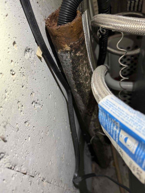 Responded to service call for clogged laundry stack affecting washer drainage. Inspection revealed significant pipe corrosion with extensive rust deterioration compromising structural integrity. Successfully cleared the obstruction and documented the severely damaged sections requiring future replacement to prevent recurrence.