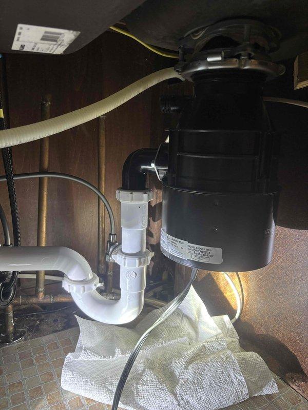Replaced leaking garbage disposal unit in kitchen. Installed new disposal with proper mounting hardware and verified watertight connections at sink flange and drain pipes. Tested operation to confirm no leaks and proper function.