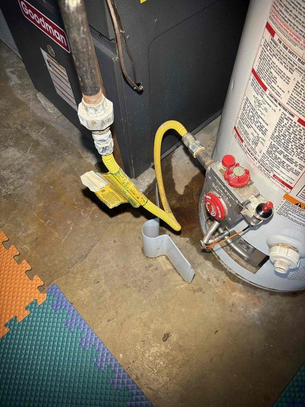 Responded to service call for non-functioning water heater with extinguished pilot light. Upon inspection, discovered severe corrosion on copper pipe connections with significant mineral buildup and water damage. Recommended replacement of aging water heater unit due to extensive deterioration of critical components and connection points.