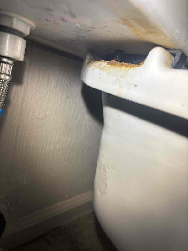 Responded to a service call regarding a persistently leaking toilet despite previous repair attempts. Inspection revealed significant water damage and corrosion at the fixture connection points, with visible staining on the ceiling area below. Successfully replaced damaged supply line components and sealed leaking connections to resolve the recurring issue.