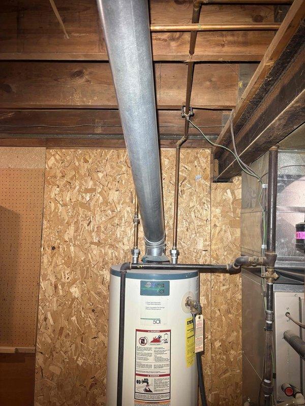 Conducted visual inspection of basement to assess reported partially collapsed sewer lateral and clogged drain. Examined existing plumbing infrastructure including water heater connections and ventilation system. Evaluated condition of copper supply lines and identified necessary repairs for the sewer lateral issue.