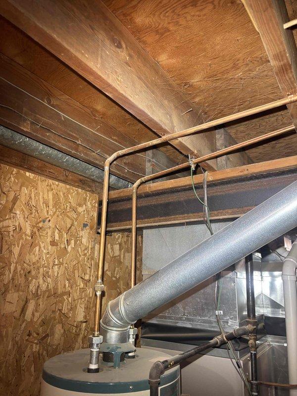 Conducted visual inspection of basement to assess reported partially collapsed sewer lateral and clogged drain. Examined existing plumbing infrastructure including water heater connections and ventilation system. Evaluated condition of copper supply lines and identified necessary repairs for the sewer lateral issue.