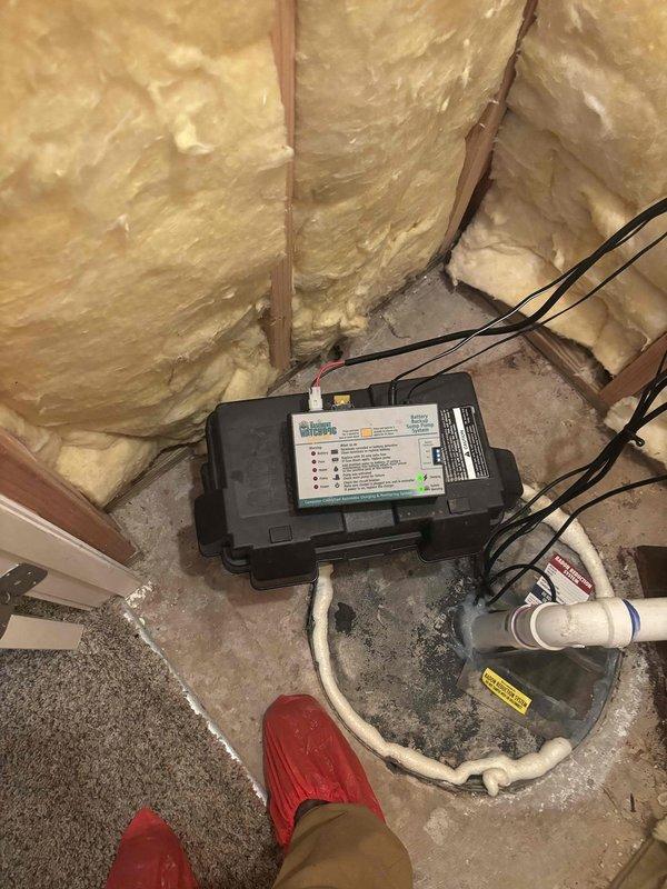 Diagnosed sump pump system that was emitting beeping noise and unresponsive to test button. Inspection revealed the unit had switched to backup battery mode as reported. Verified electrical connections to control panel and battery backup system, then restored proper functionality by resetting the system and ensuring primary power supply was correctly established.