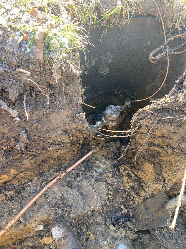 Successfully excavated and replaced underground water service line from meter to home due to leak identified by water pooling near foundation and audible running water at meter. Installed new copper water line with ball valve, pressure reducing valve, and drain valve, then properly sealed foundation penetration with hydraulic cement to prevent water intrusion.