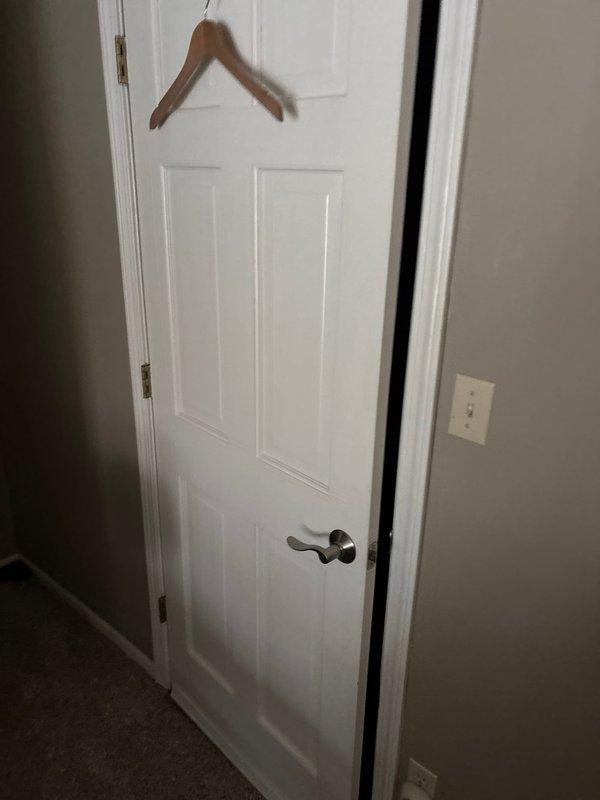 Responded to service call for garbage disposal leak and insufficient hot water production. Inspected under-sink plumbing configuration including black garbage disposal unit connected to PVC drain pipes with P-trap assembly. No active leaks were observed during inspection, and all connections appeared secure with normal working condition confirmed.