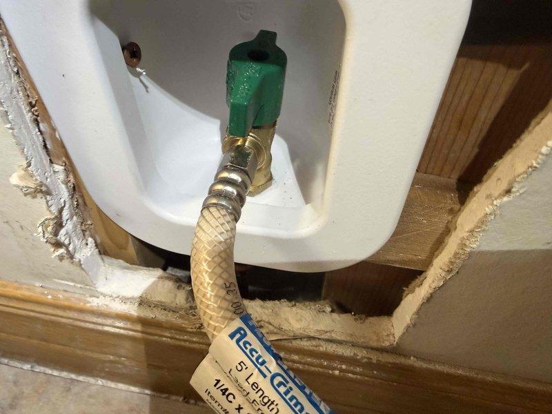 Successfully accessed wall to remove and replace ice maker box, including installation of copper supply line with proper brass fittings and connection of braided supply line to the new unit. All connections were properly soldered and tested to ensure proper functionality, though customer was informed that drywall repair was not included in the service.