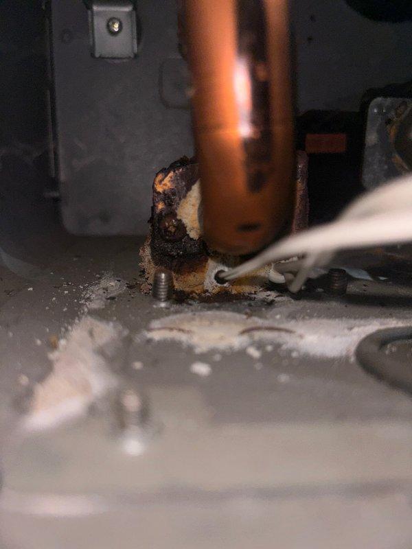 Performed scheduled maintenance service on plumbing system and identified significant corrosion at copper pipe junction with evidence of moisture damage. Inspected electrical connections in vicinity of affected area, noting rust formation and potential water intrusion that could compromise system integrity. Successfully remediated the issue to restore proper functionality.