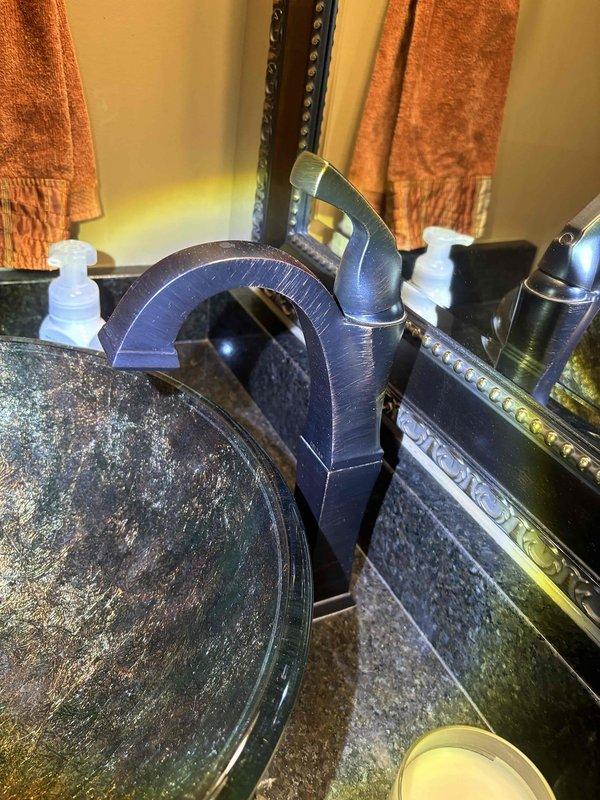 Conducted a comprehensive whole-home plumbing inspection at customer's request following promotional offer. Inspected bathroom fixtures including modern faucet and under-sink plumbing connections, verifying proper installation of supply lines and drainage components. No plumbing issues were identified; all systems functioning normally.