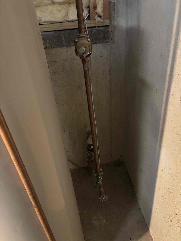 Responded to service call for non-operational water heater. Diagnosed issue with gas burner assembly, cleaned flame sensor and burner components to remove accumulated grime affecting ignition. Verified proper operation after service with even blue flame pattern and confirmed proper water heating functionality.
