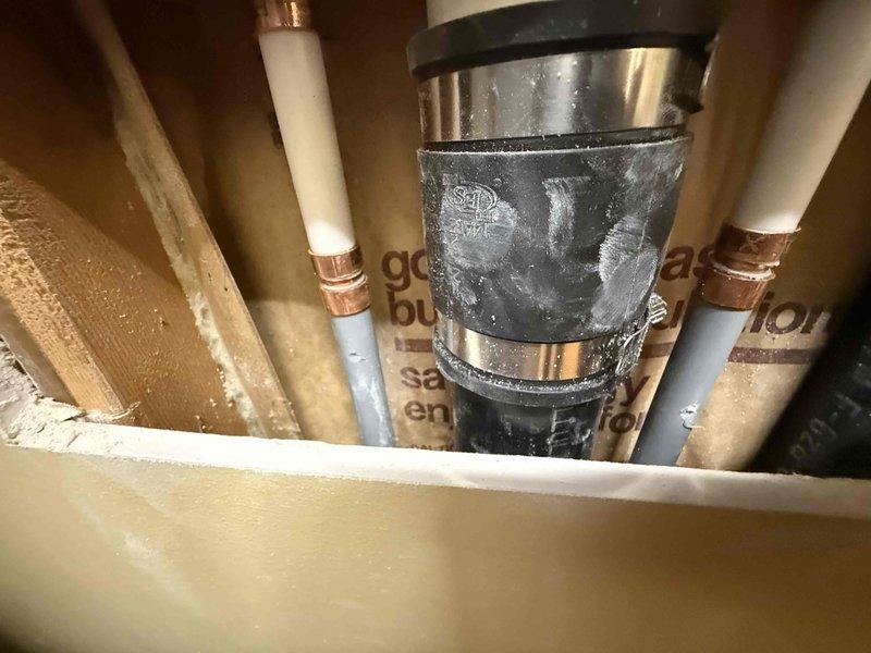 Successfully installed a new laundry box with dual water supply valves (hot and cold) and a drain connection. Completed all necessary connections including copper supply lines with brass shutoff valves and properly secured the gray corrugated drain hose within the recessed wall box. Verified proper function of all components before completing the installation.