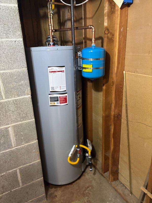 Successfully installed a 50-gallon natural gas water heater with proper gas line connections and safety valves. Mounted a code-compliant expansion tank with secure wall strapping to prevent movement. Completed all copper piping connections with professional soldering technique, ensuring proper ventilation and leak-free operation.