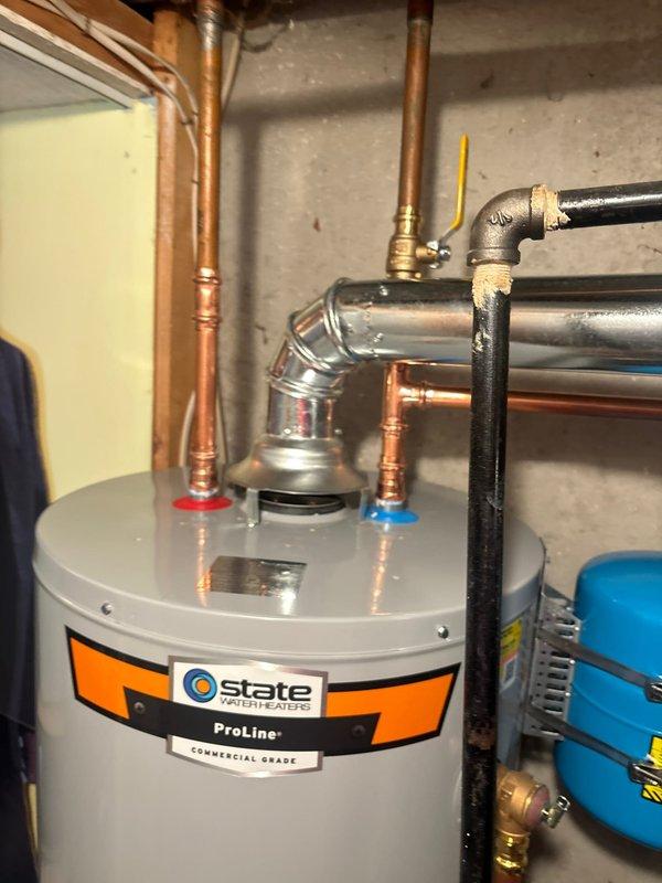 Successfully installed a 40-gallon State ProLine Commercial Grade gas water heater with thermal expansion tank and all required connections. Completed installation of ball valve shut-off for water inlet and gas cock for gas supply line. System was properly vented and all connections were verified secure with no leaks observed.