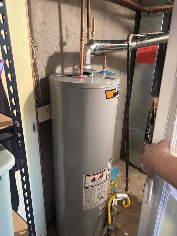 Successfully installed a 40-gallon State ProLine Commercial Grade gas water heater with thermal expansion tank and all required connections. Completed installation of ball valve shut-off for water inlet and gas cock for gas supply line. System was properly vented and all connections were verified secure with no leaks observed.