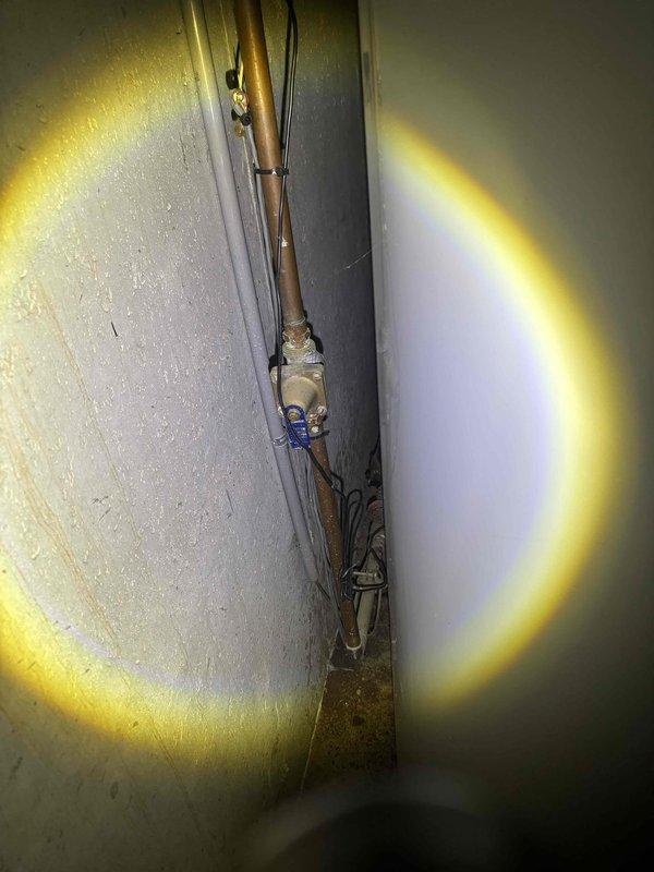 Responded to no hot water call for tanked water heater with pilot light issue. Accessed unit in basement, inspected gas valve and thermocouple assembly. Cleaned thermocouple connection points, relit pilot light, and verified proper operation of water heater with consistent flame pattern. System now producing hot water as expected.