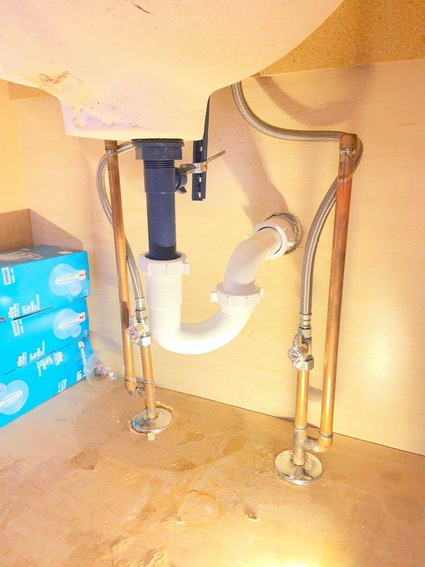 Successfully installed customer-provided faucet with pop-up drain assembly in bathroom sink. Completed all necessary plumbing connections including P-trap configuration and water supply lines with flexible stainless steel braided hoses. Tested installation for proper water flow and drainage functionality with no leaks observed.