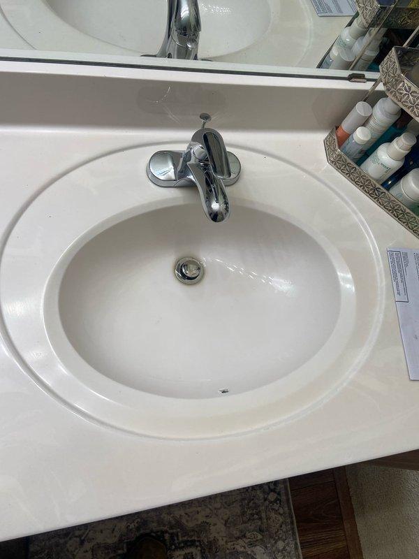 Successfully installed customer-provided faucet with pop-up drain assembly in bathroom sink. Completed all necessary plumbing connections including P-trap configuration and water supply lines with flexible stainless steel braided hoses. Tested installation for proper water flow and drainage functionality with no leaks observed.