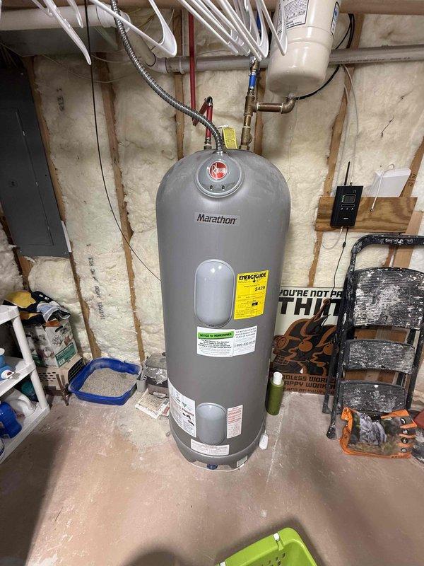 Completed on-site assessment and provided quote for upgrading from existing 50-gallon electric water heater to 80-gallon electric model. Current installation shows Marathon brand electric water heater in unfinished basement with PEX plumbing connections and proper electrical supply. Upgrade would require modifications to existing piping configuration while maintaining compliance with local code requirements.