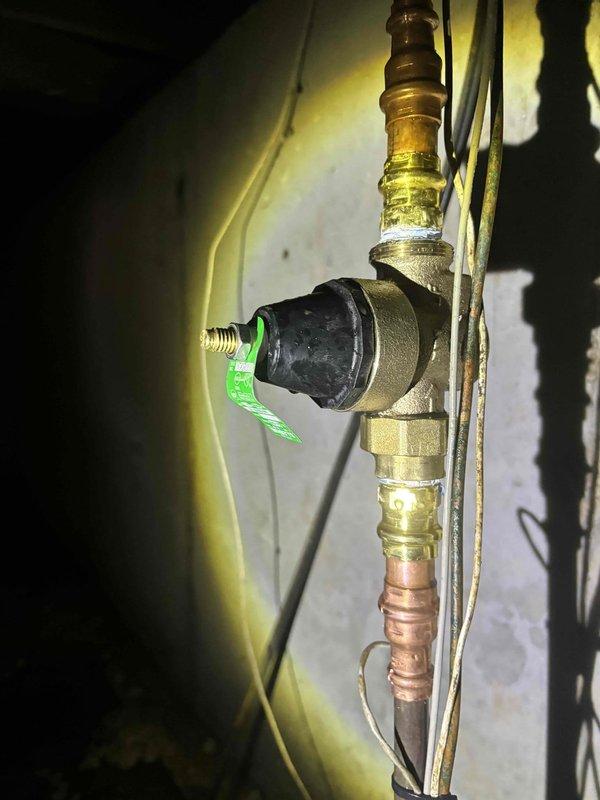 Responded to service recall for water heater producing concerning whistling noise. Upon inspection, found excessive pressure in the system causing whistling through the TPR valve. Adjusted pressure regulator valve and verified proper operation of temperature and pressure relief valve. System now functioning normally with no unusual noise.