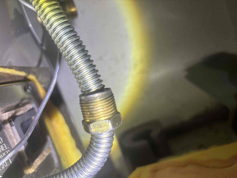 Diagnosed and serviced a tanked water heater that was not heating properly. Inspected gas line connections and flexible metal conduit, finding a loose connection at the brass fitting. Tightened connection and verified proper heating function, restoring hot water service to the property.