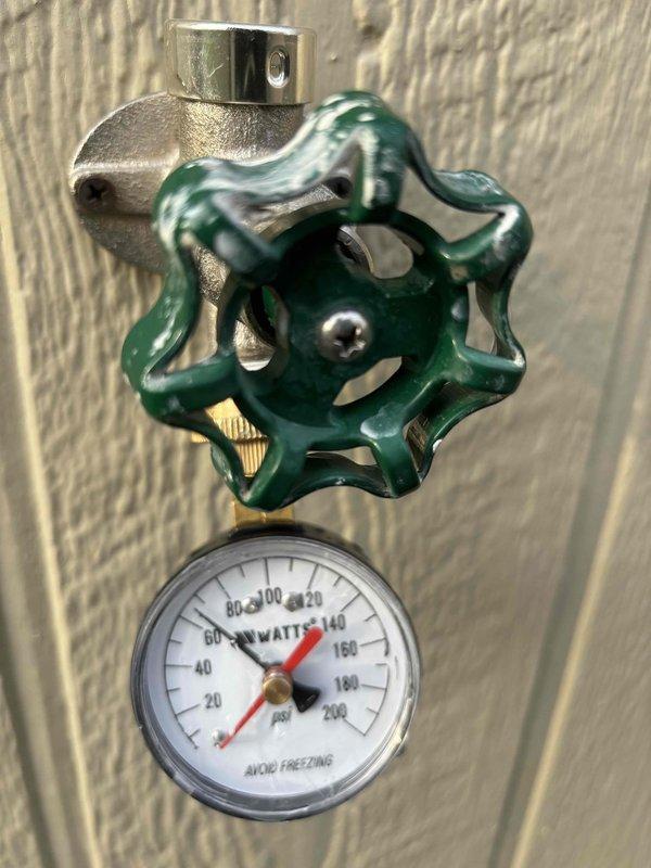 Completed on-site assessment for 50-gallon water heater replacement in basement location. Evaluated existing plumbing configuration including water softener system, copper supply lines, pressure regulation valve assembly with gauge, and connection points to determine installation requirements for customer-preferred AO Smith unit.