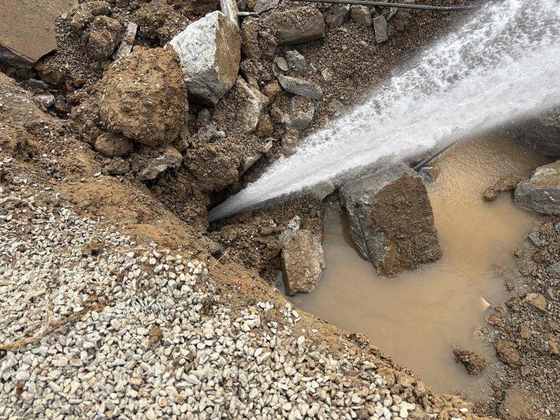 Responded to commercial site to assess water line damage resulting from building demolition activities. Upon arrival, found multiple damaged water lines with active leaks requiring immediate attention. Utilized high-pressure water spray to clear debris and expose affected piping for proper evaluation. Excavated area revealed broken water mains and service lines with significant soil erosion around the damaged sections. Documented extent of damage to underground water distribution system, including compromised pipe sections and fittings that will require replacement. Site conditions indicated need for comprehensive repair plan to restore water service to the commercial property.