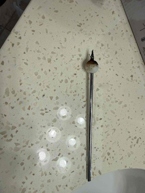 Responded to service call for bathroom sink stopper stuck in closed position. Upon inspection, removed and extracted the pop-up drain assembly linkage mechanism that had become jammed due to corrosion and debris buildup. Cleaned and tested the stopper operation to ensure proper function, restoring full drainage capability to the fixture.