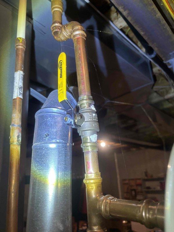 Completed comprehensive whole-home plumbing inspection during morning appointment window. Thoroughly examined all accessible plumbing systems including water heater installation, supply and drain lines, gas piping with proper certification tags, expansion tank mounting, and basement utility area infrastructure. All systems photographed and documented, with copper piping, PVC drainage, and mechanical connections assessed for proper installation and current condition.