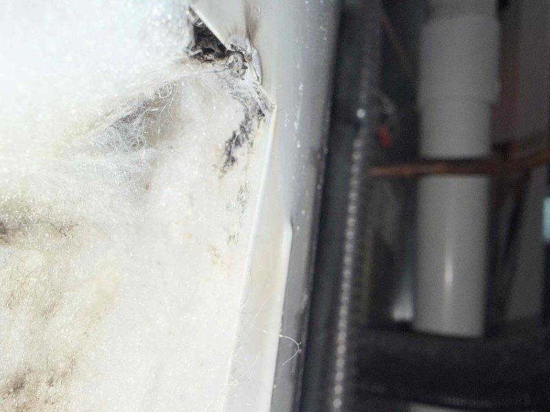 Responded to complaint of hot water heater rapidly depleting hot water supply in residential property. Diagnosed potential dip tube failure or malfunctioning lower heating element causing inadequate hot water capacity. Evaluated tank-style water heater system located in utility room adjacent to kitchen. Consulted with homeowner regarding installation of hot water recirculation system to minimize wait time for hot water delivery at fixtures throughout home. Documented existing plumbing configuration and equipment condition through photographic evidence for service records and future reference.
