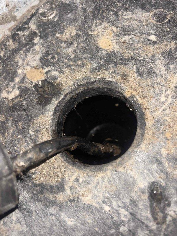 Responded to reported toilet leak in basement causing carpet water damage. Upon inspection, identified deteriorated wax ring seal at toilet base as primary source of leak. Floor flange showed significant corrosion and wear, requiring replacement to ensure proper seal. Removed toilet, replaced failed wax ring and corroded floor flange with new components. Reinstalled toilet with proper bolting and sealing. Tested for leaks by flushing multiple times and confirmed no water discharge at base. Advised on carpet drying procedures to prevent mold growth.
