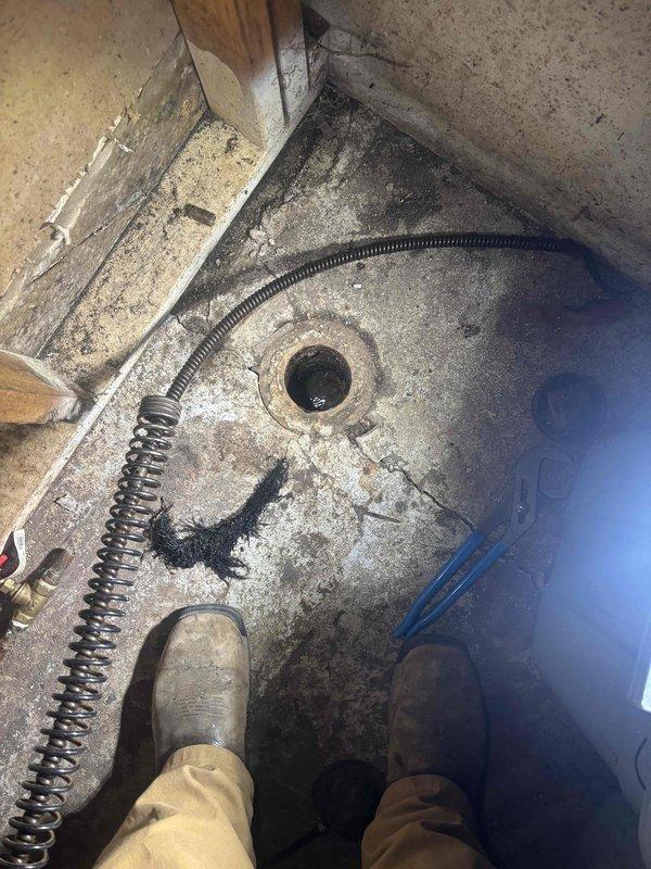 Performed main drain cleanout service on a 55-year-old residential property. Located and accessed the main drain cleanout in the basement, utilizing professional drain cleaning equipment to clear the line and restore proper drainage. Upon inspection of the bathroom facilities, identified a deteriorating wax seal on the toilet that will require future attention to prevent water damage and ensure proper fixture sealing.