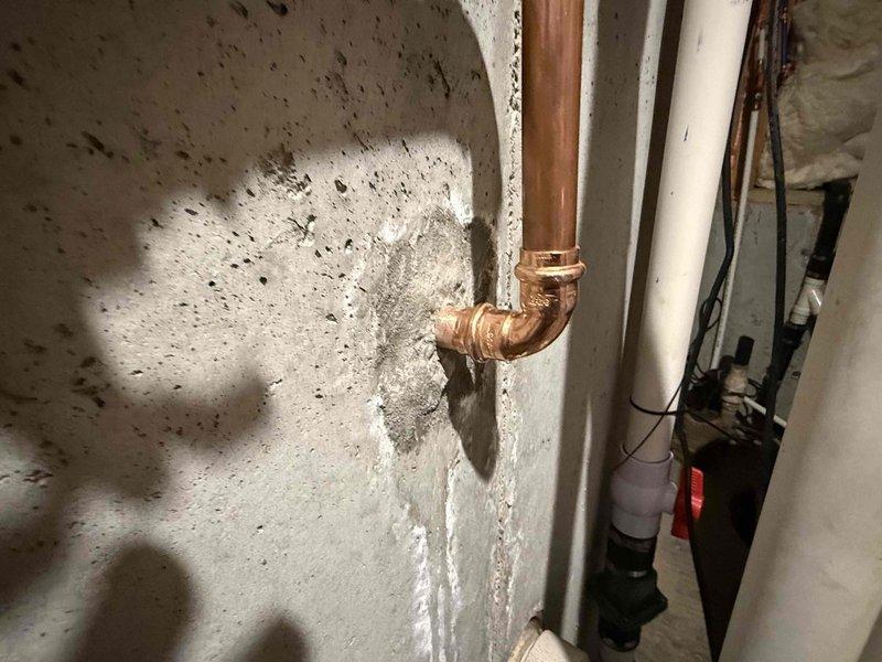 Installed a new 3/4" pressure reducing valve (PRV) on the main water line in the basement utility area. Replaced all existing push-fit connections with permanent copper fittings, utilizing 3/4" copper pipe and brass fittings throughout to ensure a durable, code-compliant installation. The upgraded system includes a brass manifold with multiple shut-off valves for zone control and an integrated pressure gauge for monitoring water pressure, eliminating the risk of failure associated with the previous push-fit connections.