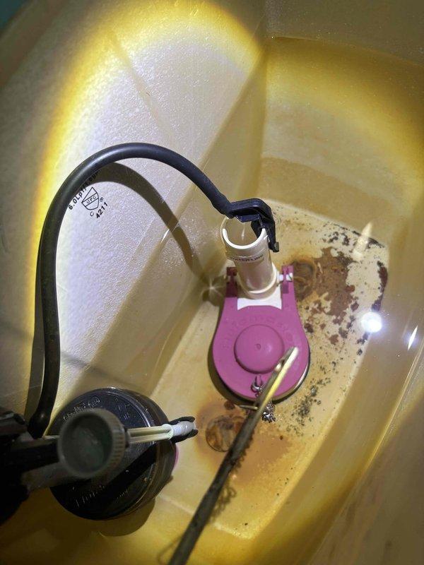 Responded to callback for main level hallway toilet that continued to run and cycle intermittently. Upon inspection, found deteriorated fill valve assembly with corroded internal components and mineral buildup causing improper shutoff. Replaced faulty fill valve mechanism and tested flush cycle to verify proper operation and water level control.