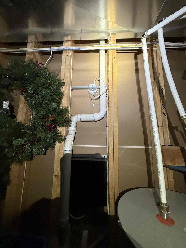 # Plumbing Maintenance Completed

Performed comprehensive plumbing maintenance on residential property addressing multiple leaking faucets throughout the house. Inspected kitchen sink plumbing system including garbage disposal unit, P-trap configuration, and dishwasher connection line to verify proper operation and check for leaks. Examined basement utility area plumbing including white PVC drainage and ventilation piping system with multiple elbows and joints running along framed walls. All accessible plumbing fixtures and connections were evaluated for wear, corrosion, and proper function. Tightened connections and replaced worn components as needed to eliminate leaks and restore proper water flow. Verified all repairs were secure and tested systems for proper drainage and operation before completing maintenance service.