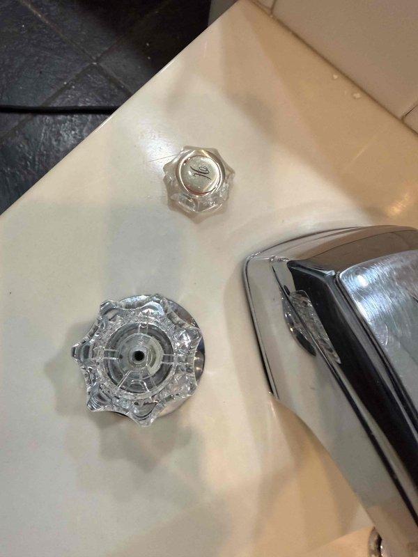 Responded to service call for broken faucet in master bathroom tub. Upon arrival, replaced defective faucet handles and installed new chrome spout assembly. During inspection, identified water damage on ceiling indicating previous leak from plumbing fixture, which was documented with photographs for customer awareness. All faucet components were properly secured and tested for functionality and leaks before completing the service.