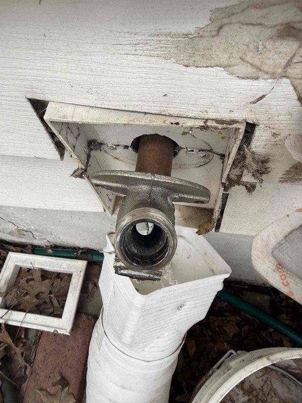 Responded to outdoor spigot leak where the top plug was damaged and inoperable. Upon inspection, discovered extensive water damage to surrounding wooden structure with significant deterioration and moisture staining indicating long-term leak. Accessed plumbing through damaged ceiling area, revealing compromised pipe connections and fittings. Replaced faulty outdoor spigot valve assembly with new chrome-plated fixture, ensuring proper threaded connections and secure mounting to wall structure. Verified all connections for proper seal and tested system for leaks before completing installation.