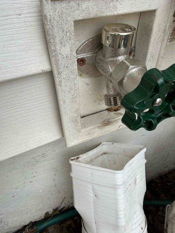 Responded to outdoor spigot leak where the top plug was damaged and inoperable. Upon inspection, discovered extensive water damage to surrounding wooden structure with significant deterioration and moisture staining indicating long-term leak. Accessed plumbing through damaged ceiling area, revealing compromised pipe connections and fittings. Replaced faulty outdoor spigot valve assembly with new chrome-plated fixture, ensuring proper threaded connections and secure mounting to wall structure. Verified all connections for proper seal and tested system for leaks before completing installation.