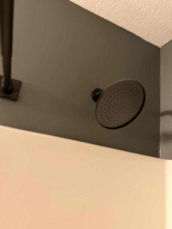 Responded to water leak concerns affecting basement from bathroom fixtures. Addressed tub spout that was leaking behind wall by inspecting rough-in plumbing connections, installing new trim kit with proper seals, and pressure testing system to confirm leak elimination. Investigated toilet leak penetrating to basement level, diagnosed wax ring failure, replaced wax ring and verified toilet flange integrity, then conducted flush testing to ensure watertight seal. Documented all repairs with photographic evidence showing completed installations including new tub spout assembly with chrome finish and proper escutcheon plates, as well as overhead ventilation component. All plumbing fixtures tested and confirmed leak-free for real estate transaction documentation purposes.